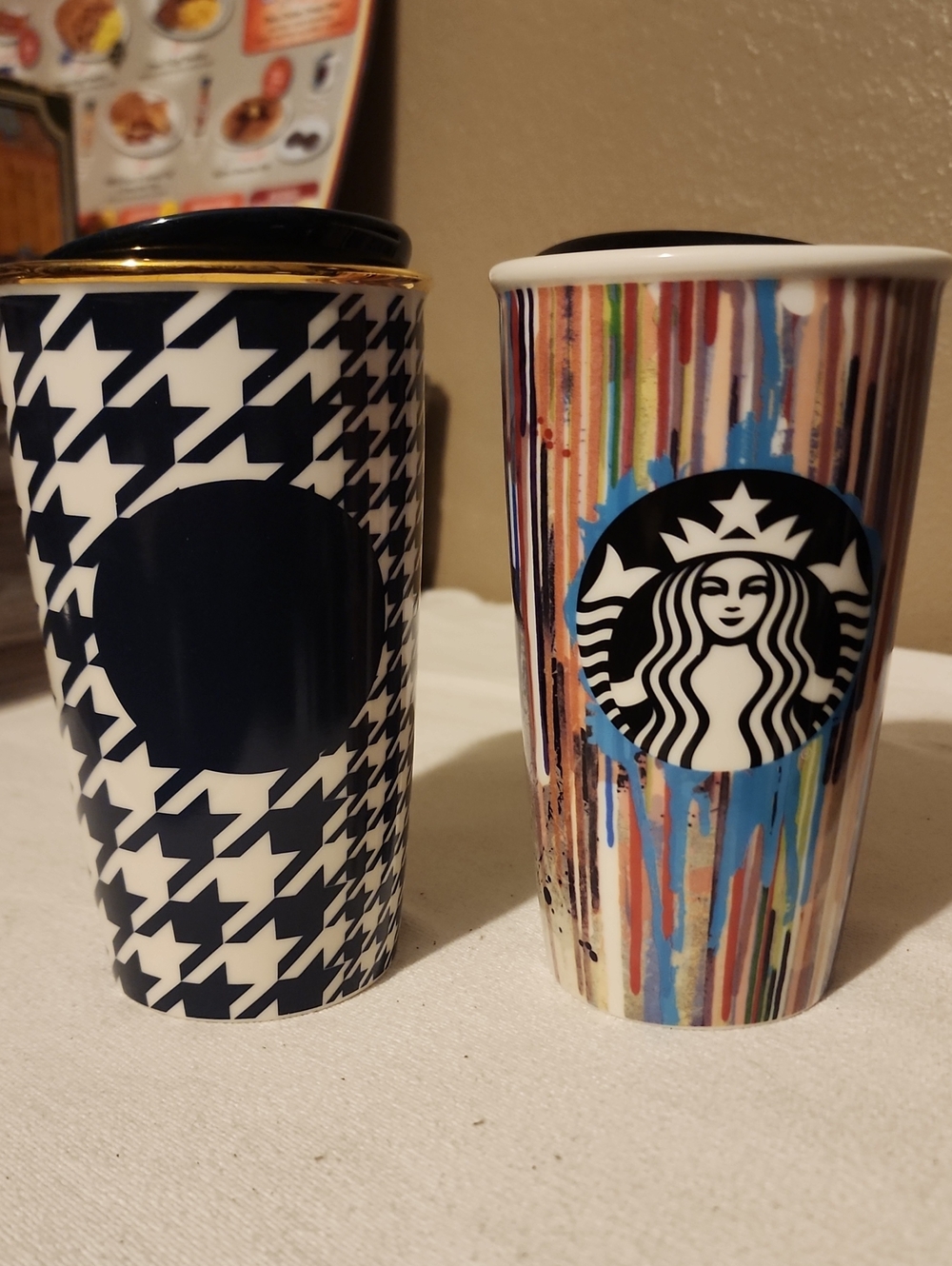 Starbucks White Ceramic Travel Mug with Multicolor Drip Stripe Design